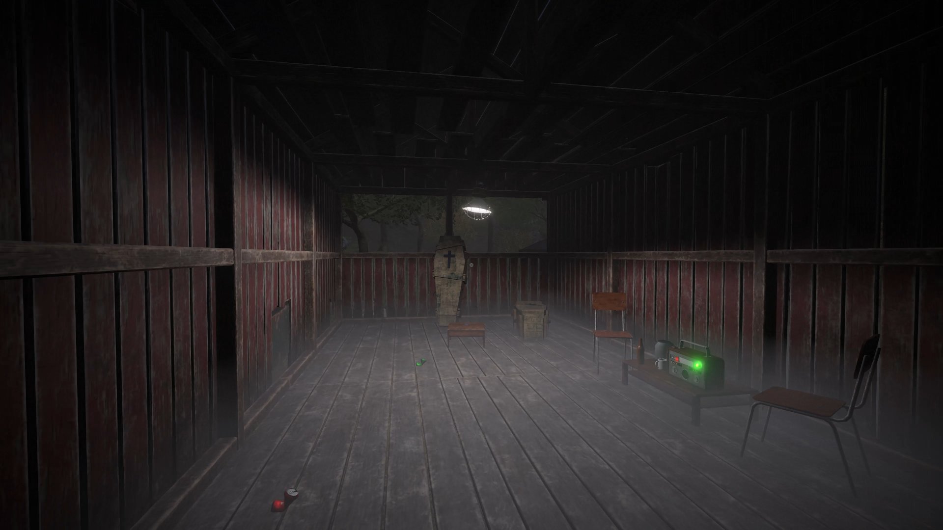 Barn interior with a hanging figure at the far end